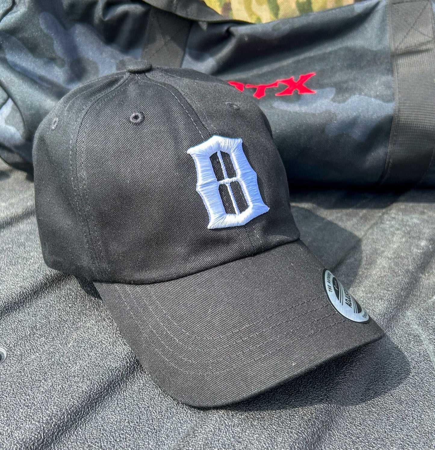 OTX Raised Black "O" Yupoong Cap